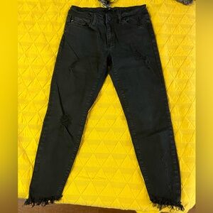 Women’s ankle length distressed black denim pants. Size 28